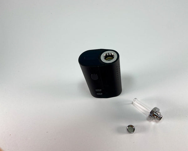 Mini dry herb vaporiser. Disassembled with mouthpiece.